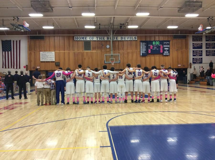 Devils Honor Alumnus, Defeat Huskies in OT at Annual Pink Out