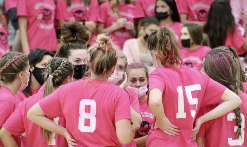 Members of the Coginchaug Volleyball team in the Dig Pink game against North Branford on October 21st. 