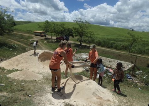 A group of CRHS students works during a summer mission trip to the Dominican Republic.