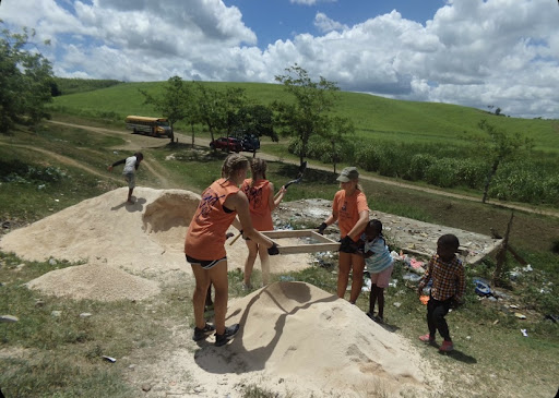 A group of CRHS students works during a summer mission trip to the Dominican Republic.